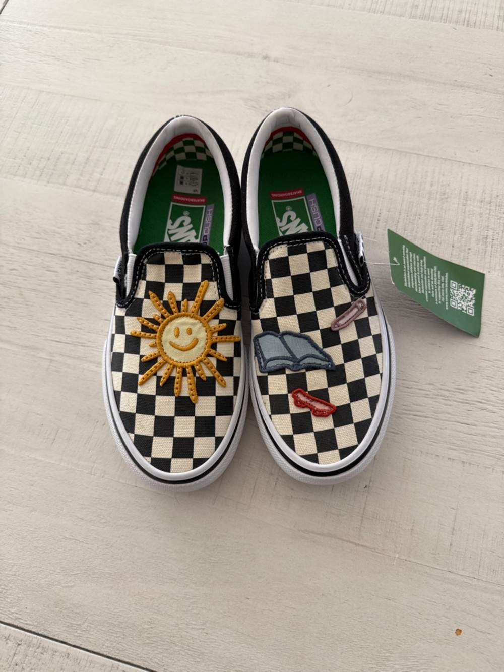 Vans Black & White Checkerboard Slip-On Sneakers with Sun Patch